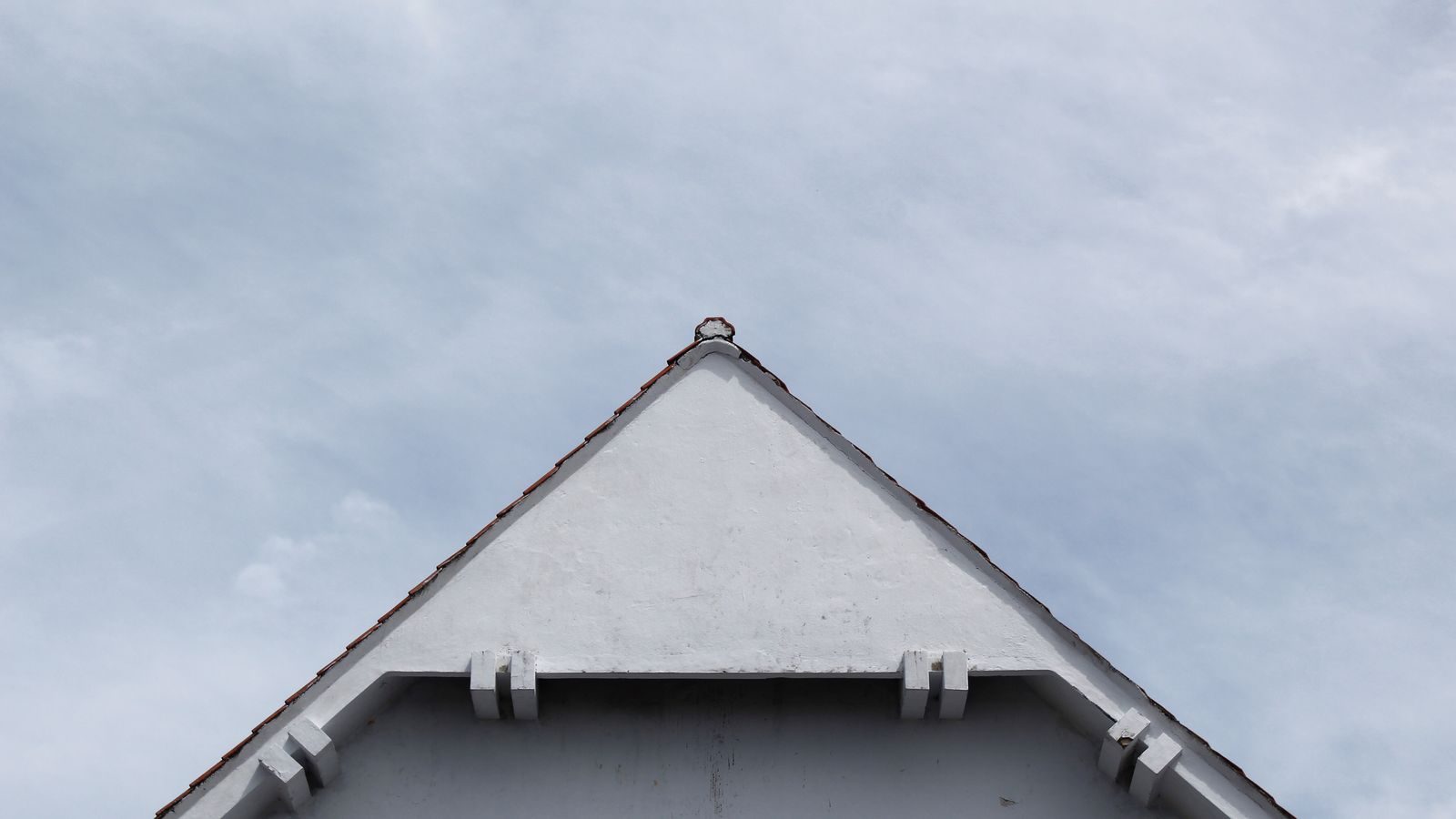 A bright white fascia and bargeboard on a gable end